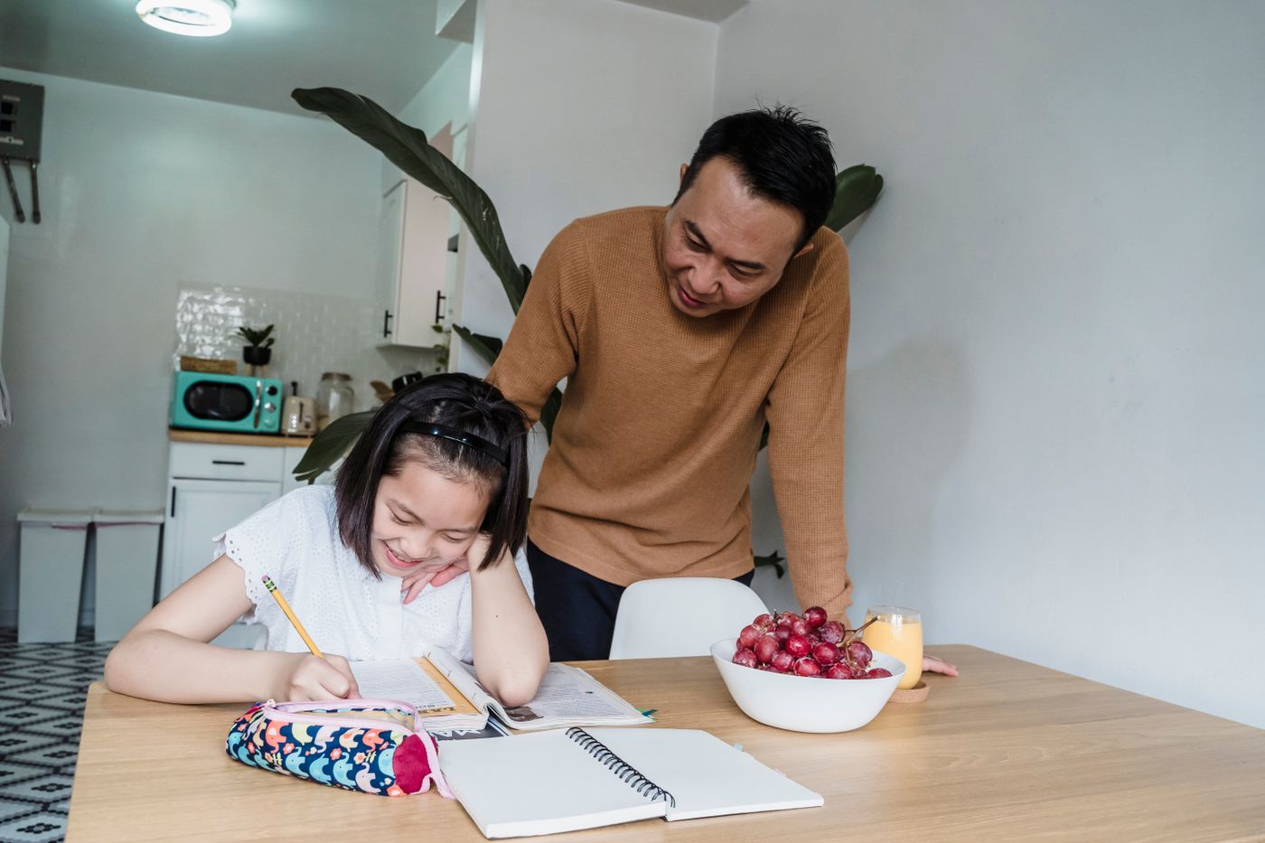 A parent supporting a child’s learning at home
